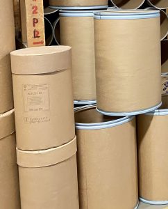 close up of two types of fibre barrels customers can order The Master Package Fibre Shipping Containers
