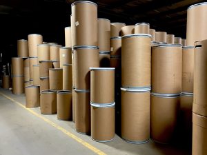 fibre drum barrel containers with steel bands organized in warehouse The Master Package Fibre Shipping Containers