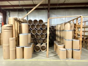 fibre barrels with steel bands stored and ready to ship at The Master Package Fibre Shipping Containers facility