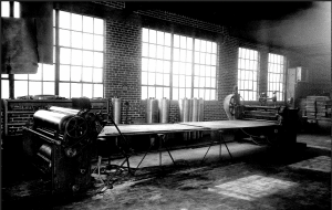 historic photo of manufacturing process of fibre barrels at start of process The Master Package Fibre Shipping Containers