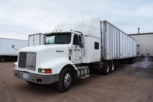 close up of Master Trucking vehicle ready to transport The Master Package Fibre Shipping Containers