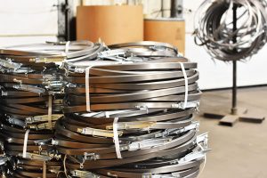 steel bands ready to be put on fibre barrels The Master Package Fibre Shipping Containers