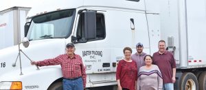 The Master Package Fibre Shipping Container company family business-a group photo near truck