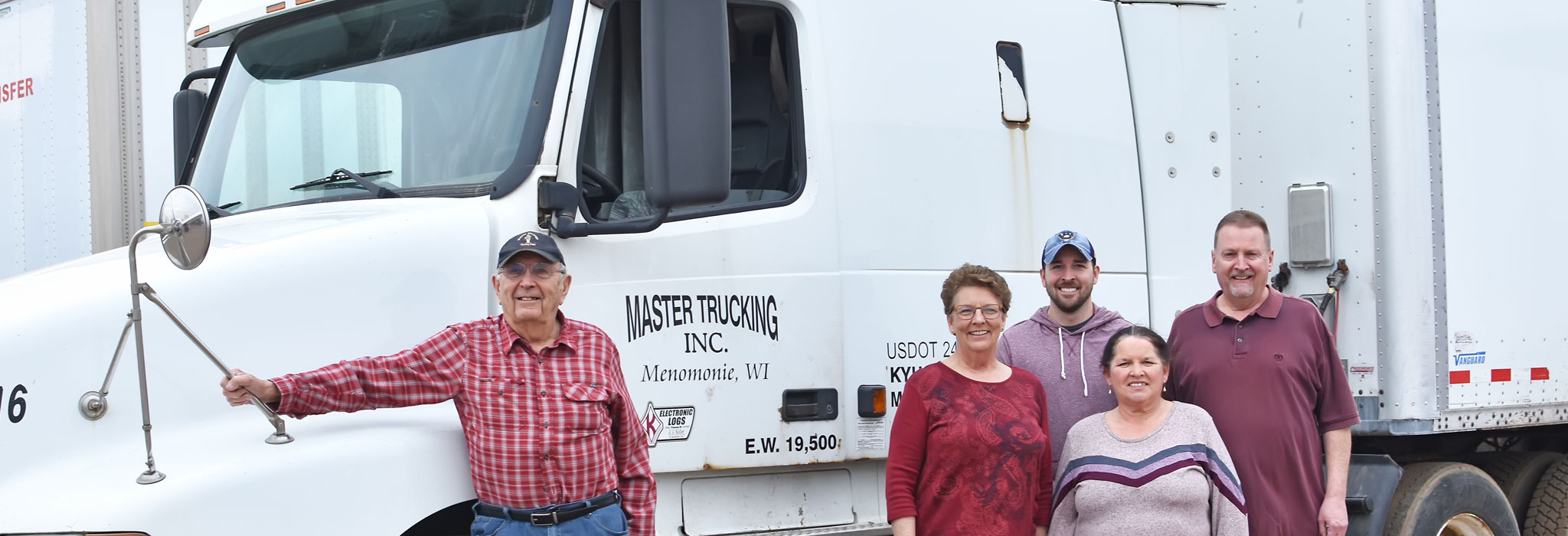 The Master Package Fibre Shipping Container company family business-a group photo near truck